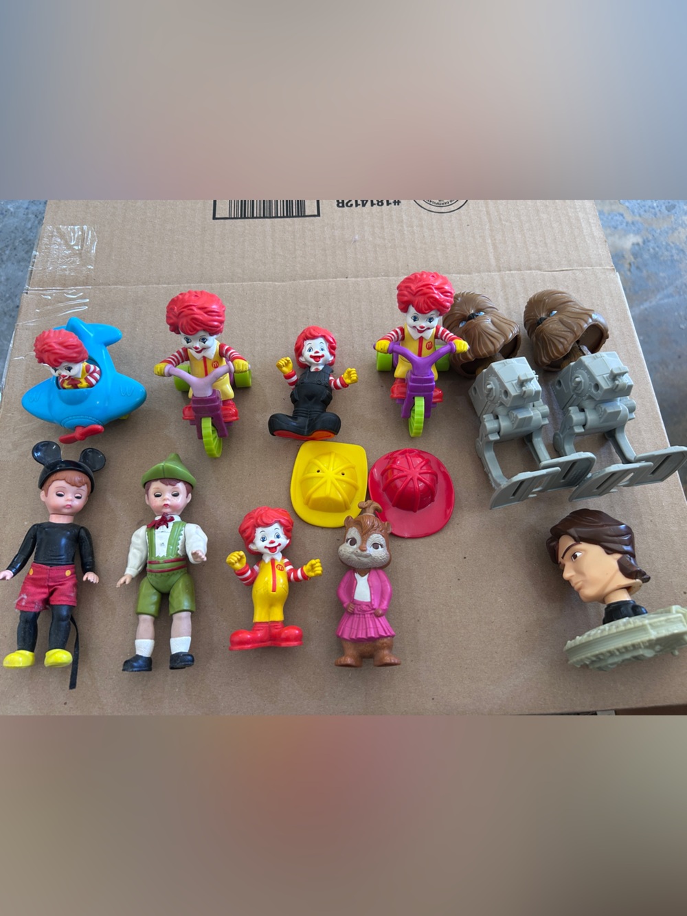 13 Random happy meal toys.  Star Wars, Ronald McDonald, chipmunks, Alexander.